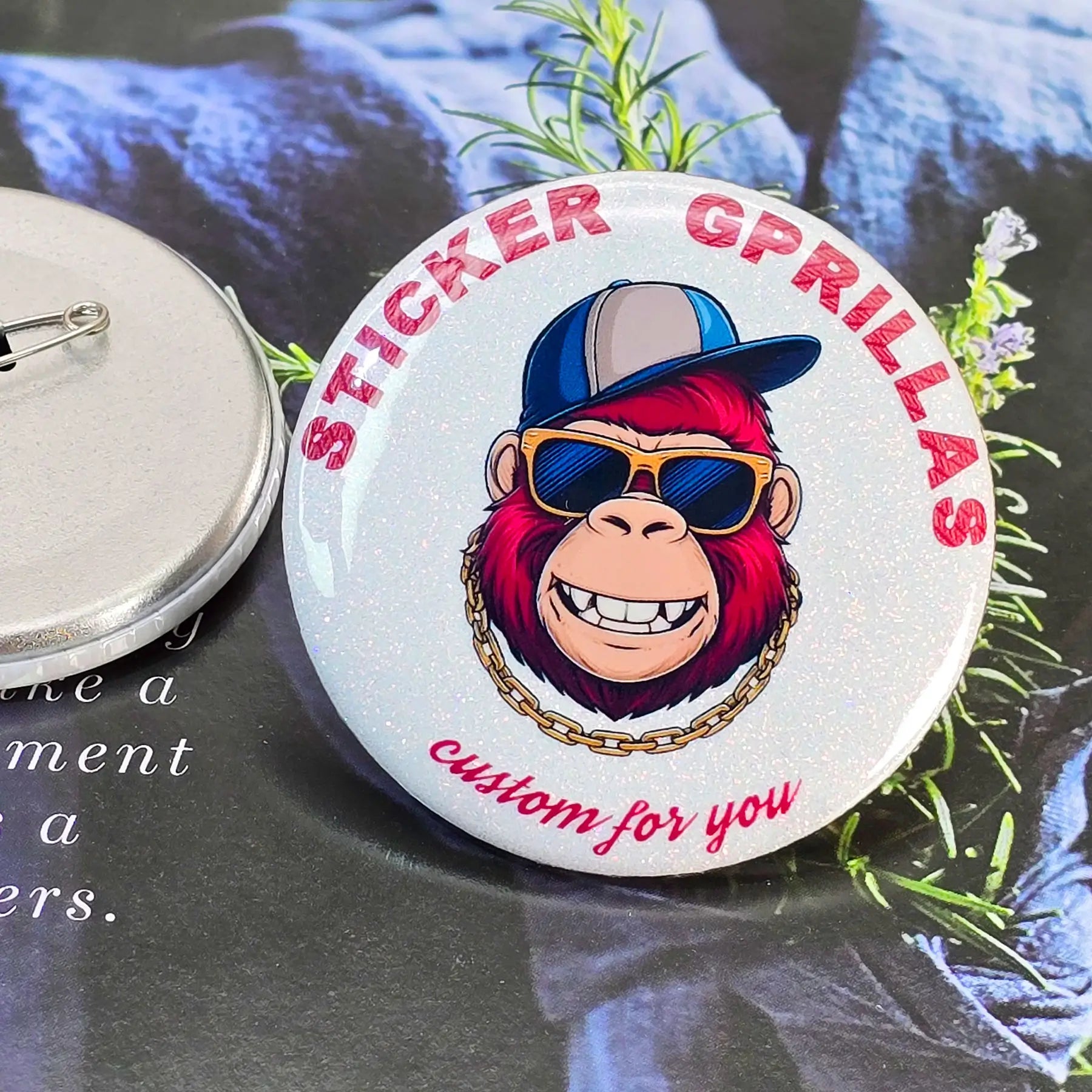 Close-up of custom button materials showing mother of pearl, colored sand, holo broken and laser gem finishes