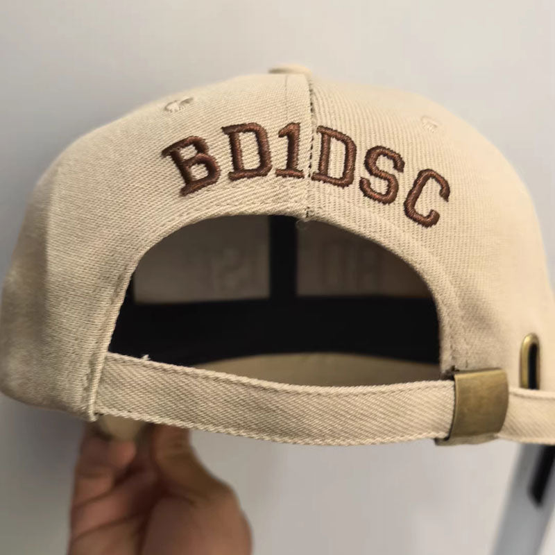 Back panel embroidery on a khaki cotton twill custom baseball cap