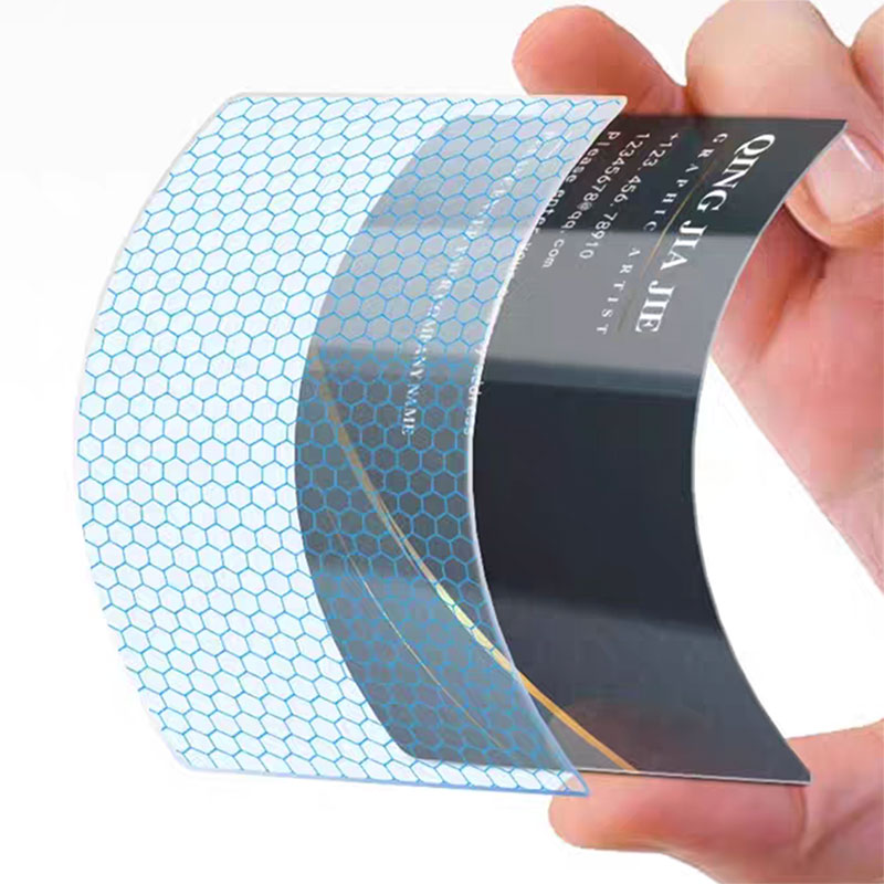 Close-up of a glossy PVC business card showing rich ink depth and bright color reproduction.