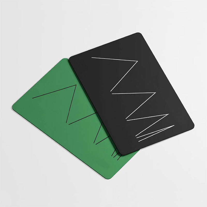 Multi-angle view of a custom PVC business card to show the material thickness and clean die-cut edges.